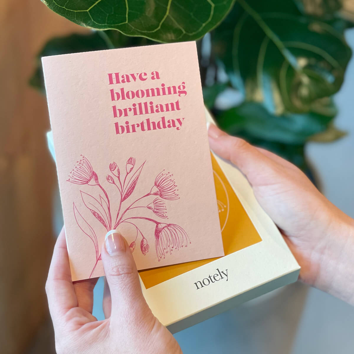 Notely Cup Notes card in pink with &quot;Have a blooming brilliant birthday&quot; printed on the front.