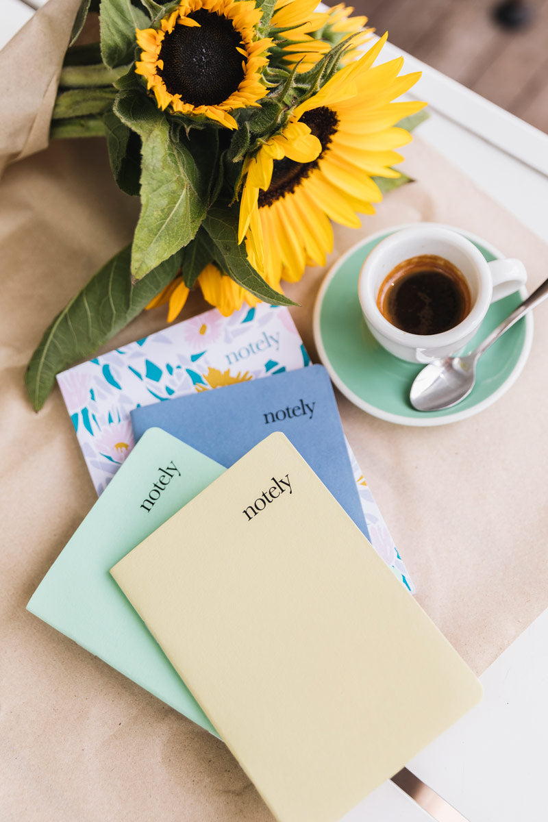 Notely Lemon and Grey Pocket Notebooks with coffee and sunflowers