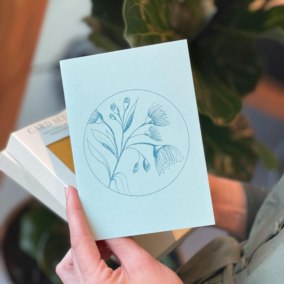 Turquoise Botanical Card in hand